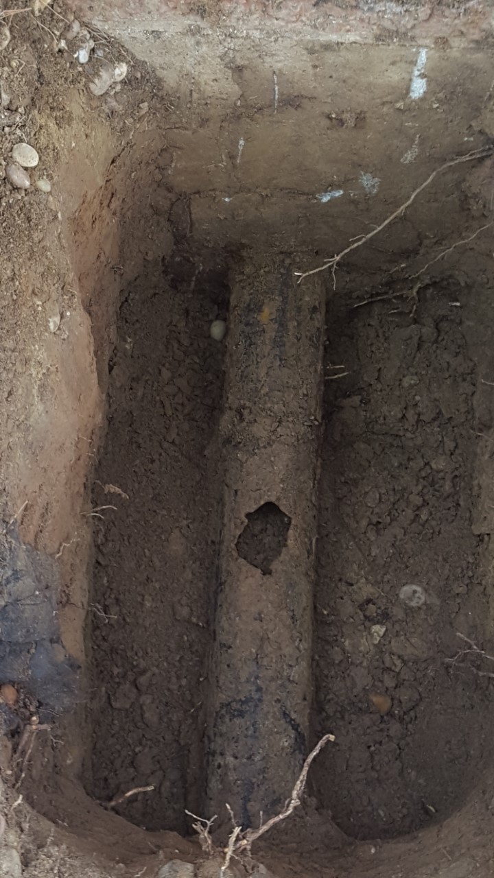 broken sewer pipe in ground